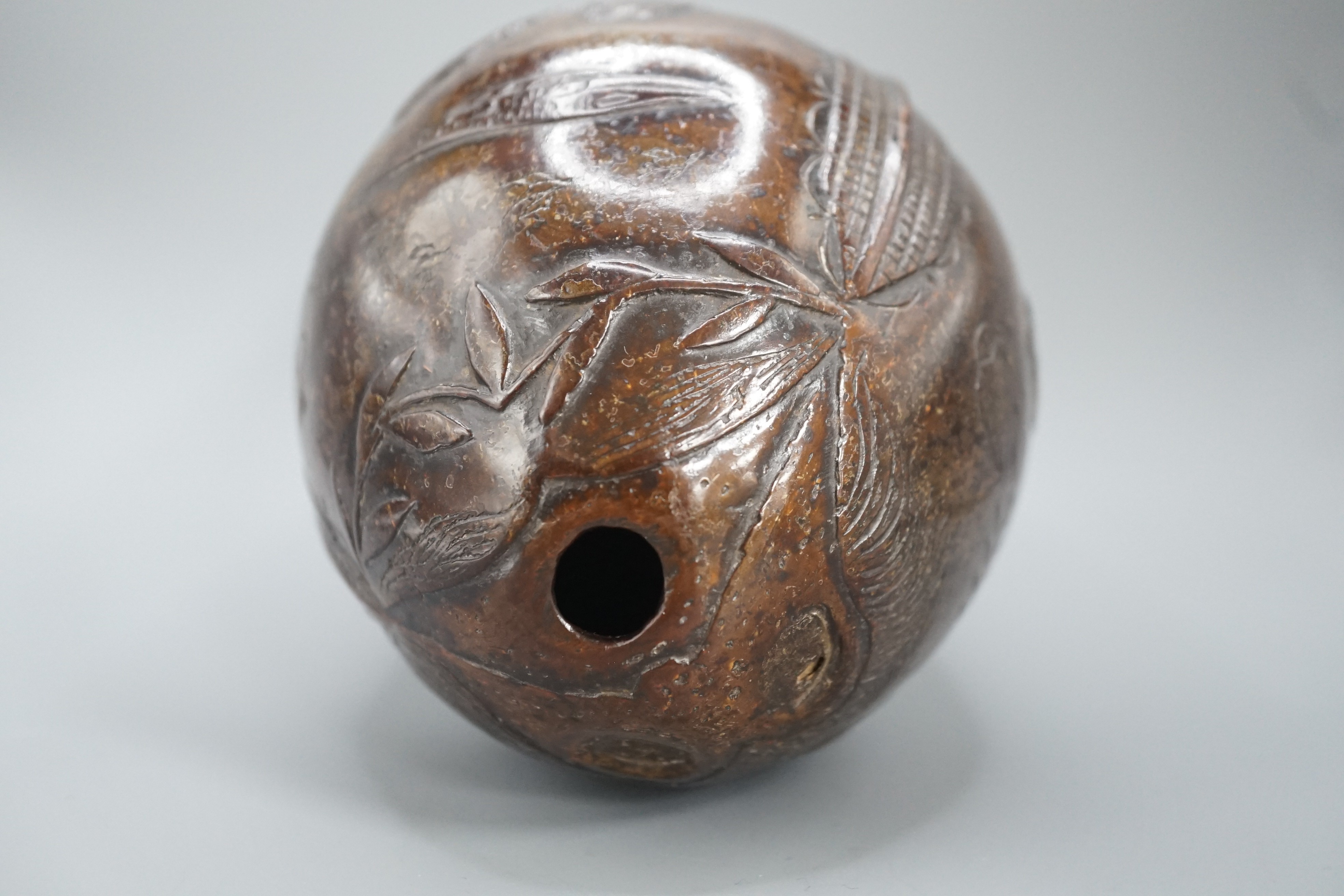 A 19th century carved coconut, 14 cm